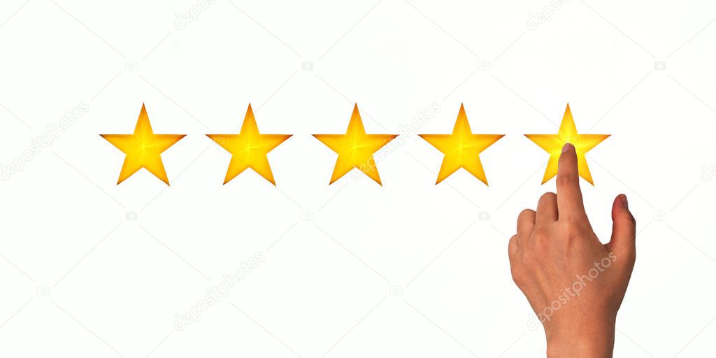 A woman clicks on a star rating, the concept of a positive rating, reviews and feedback. White background