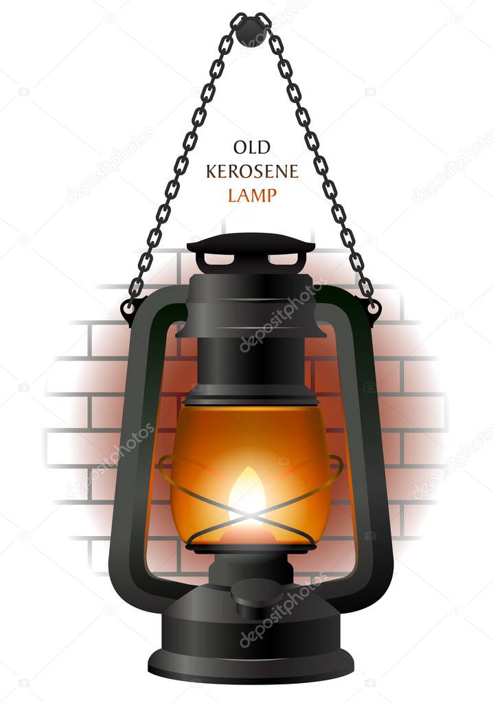 Old kerosene lamp on the brick wall fragment.