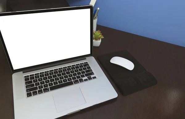 Desk Laptop and mobile with blank text space screen in office on wood table. Laptop mock-up conceptual workspace image.