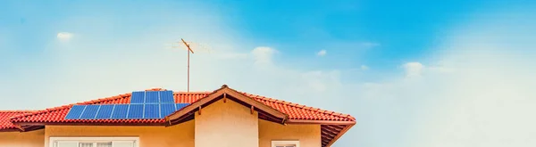 Photovoltaic power plant installation on the roof of a residential building on sunny day - Solar Energy concept image.