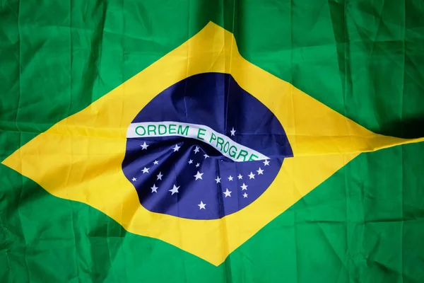 Brazilian flag kneaded - Dramatic image. — Stock Photo, Image