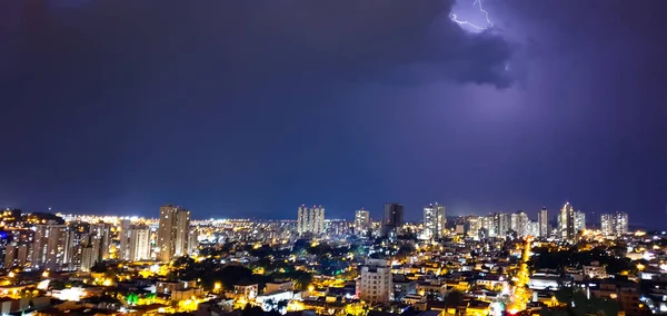Dark sky and thunder rays in the city skyline