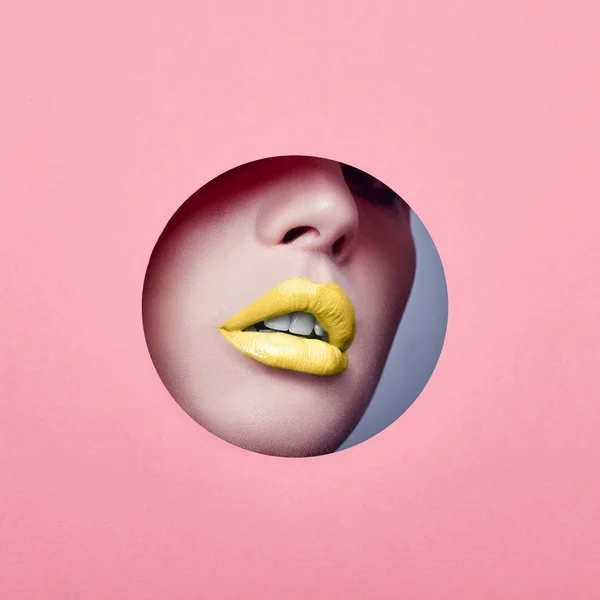 Advertising Beautiful plump lips bright yellow color, woman look