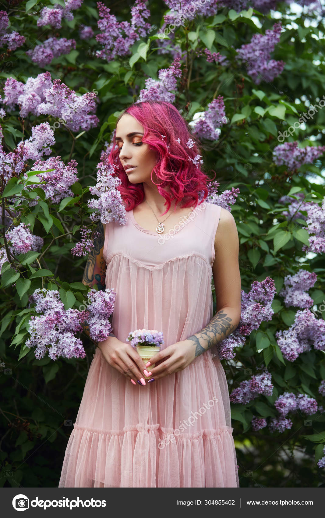 Fashion Girl With Bright Red Dyed Hair In Apple And Lilac Flower