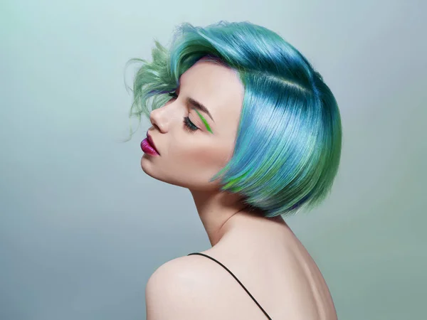 Portrait of a woman with bright colored flying hair, all shades