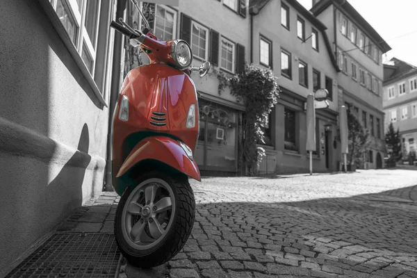 Red scooter on medieval town empty street — Stock Photo, Image