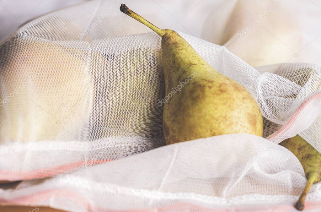 Ripe pears in an eco-friendly reusable bag