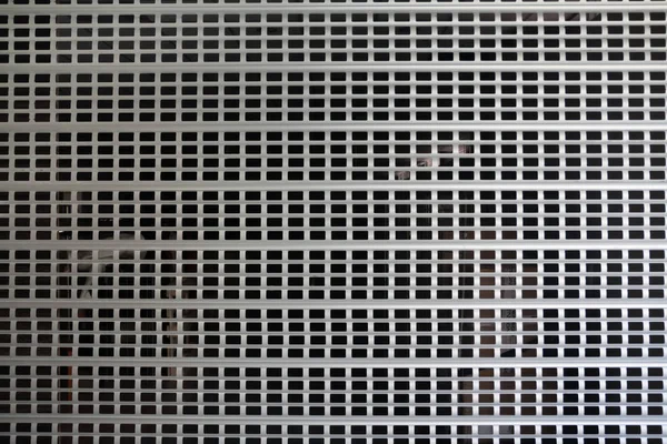 Metallic roll up door and lattice background