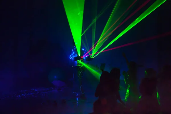 Colorful lights show. Laser show in motion in dark.