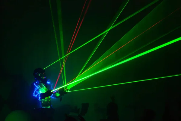 Colorful lights show. Laser show in motion in dark.