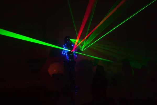 Colorful lights show. Laser show in motion in dark.