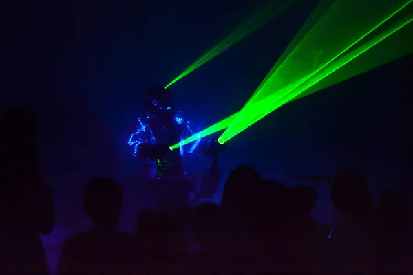 Colorful lights show. Laser show in motion in dark.