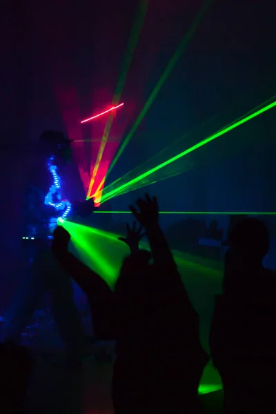 Colorful lights show. Laser show in motion in dark.