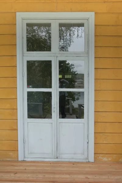 Old white wooden door with stained glass. — Stock Photo, Image