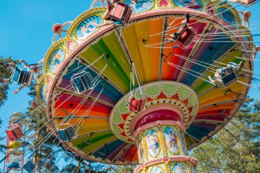 Kouvola, Finland - 18 May 2019: Ride Swing Carousel in motion in amusement park Tykkimaki clipart