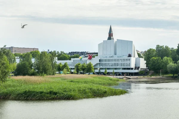Helsinki, Finland - June 12, 2019: Toolo bay in the City Park in Helsinki, Finlandia Hall congress and event venue can be seen across the water