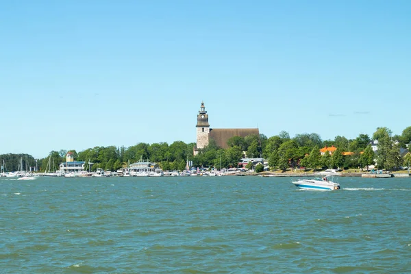 Naantali, Finland - 28 June, 2019: View from the sea of Naantali harbor and medieval stone church at sunny summer day, Finland — Stock Photo, Image