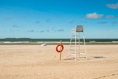 Lifeguard tower and lifering on beautiful sandy beach Yyteri at summer, in Pori, Finland clipart