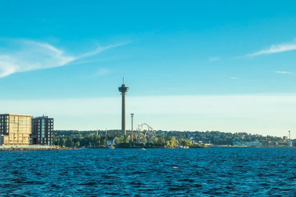 Tampere, Finland - 24 June 2019: Sarkanniemi amusement park with Nasinneula tower, view over the water at sunset — Stock Photo, Image