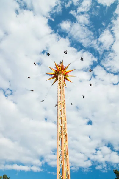 Kouvola, Finland - 10 August 2019: Ride Star Flyer in motion on cloudy sky background in amusement park Tykkimaki — Stock Photo, Image