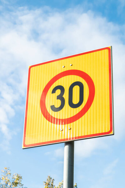 Finnish speed limit sign 30 km h on blue sky background