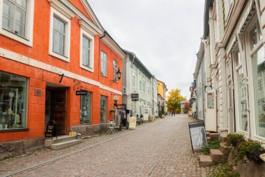 Porvoo, Finland - 2 October 2019: Street of Old Porvoo, Finland. Beautiful city autumn landscape with colorful buildings.