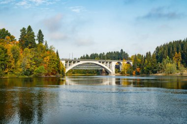 Autumn landscape of bridge and Kymijoki river waters in Finland, Kouvola, Koria clipart