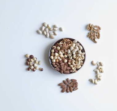 Sağlıklı gıda. Fındık Taş Masa üstü görünümünde ürün yelpazesine karıştırın. Arka plan görüntüsü için farklı baklagiller topluluğu yakın fındık, Antep fıstığı, badem, kaju fıstığı, fıstık, ceviz kadar. görüntü