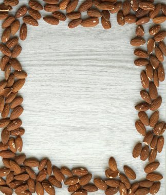 Arka plan görüntüsü için sağlıklı gıda kadar badem fındık kapatın. Doku beyaz gri masa üstü görünümü