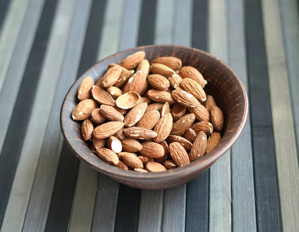 Healthy food  for background image close up almond nuts. Texture Nuts on the cup plate — Stock Photo, Image