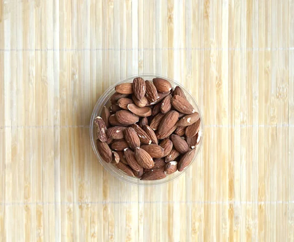 Healthy food  for background image close up almond nuts. Texture Nuts on the cup plate — Stock Photo, Image