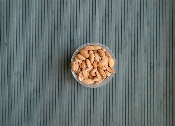 Healthy food  for background image close up almond nuts. Texture Nuts on the cup plate — Stock Photo, Image