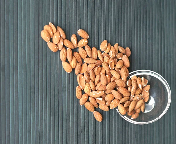 Healthy food  for background image close up almond nuts. Texture Nuts on the cup plate — Stock Photo, Image