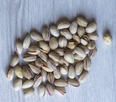 Arka plan görüntüsü için sağlıklı gıda antep fıstığı kapatın. Üst görünümde Doku Somunları sahte