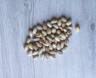 Arka plan görüntüsü için sağlıklı gıda antep fıstığı kapatın. Üst görünümde Doku Somunları sahte