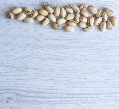 Arka plan görüntüsü için sağlıklı gıda antep fıstığı kapatın. Üst görünümde Doku Somunları sahte