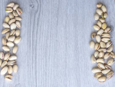 Arka plan görüntüsü için sağlıklı gıda antep fıstığı kapatın. Üst görünümde Doku Somunları sahte