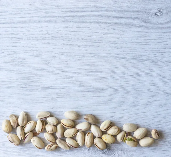 Arka plan görüntüsü için sağlıklı gıda antep fıstığı kapatın. Üst görünümde Doku Somunları sahte