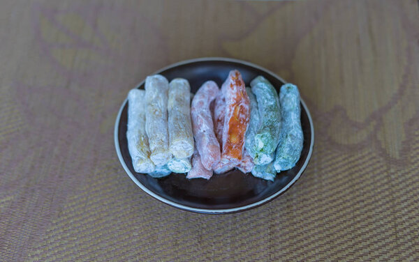 Traditional Turkish Delight. Oriental dessert on a  plate. Isolated on background. Eastern delicacy sweets. Healthy food mix assortment. Collection of different for image close up top view