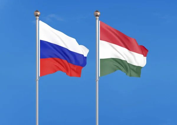 俄罗斯 匈牙利俄罗斯和匈牙利的厚彩色丝绸国旗 天空背景上的 — 图库照片