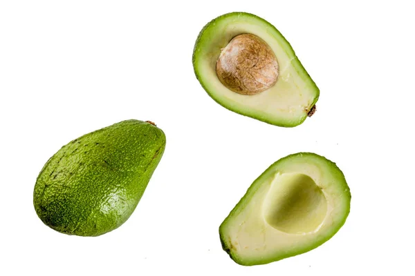 Avocado Helften Geheel Geïsoleerd Een Witte Achtergrond Eenvoudig Patroon — Stockfoto