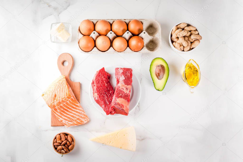 Ketogenic low carbs diet concept. Healthy balanced food with high content of healthy fats. Diet for the heart and blood vessels. Organic food ingredients, white marble background, copy space top view