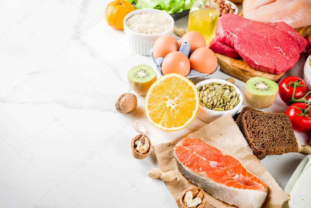 Healthy diet food. Various low fodmap ingredients selection - meat, vegetables, berry, fruit, grains, Trendy healthy lifestyle concept. On white marble background copy space top view