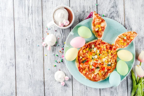 Funny easter food, ideas recipes for children Easter party, healthy  kids pizza with vegetables, top view copy space