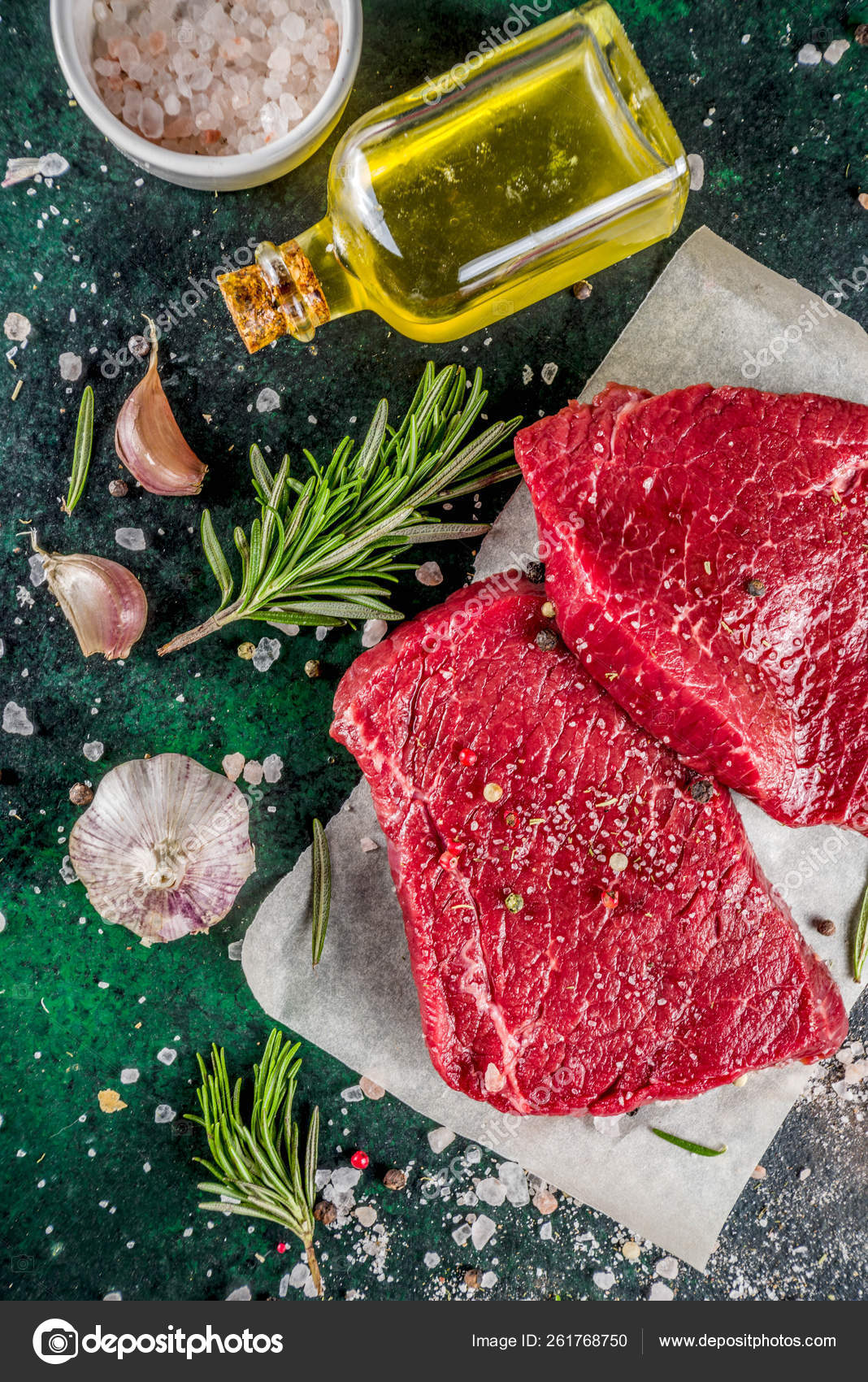 Raw beef meat steaks with spices Stock Photo by