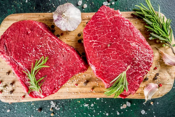 Raw beef meat steaks with spices