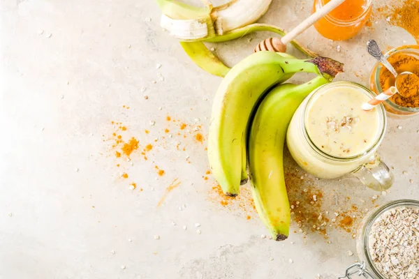 Smoothie with banana, oatmeal and turmeric — Stock Photo, Image