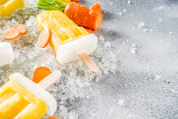 Vegan carrot ice cream popsicles