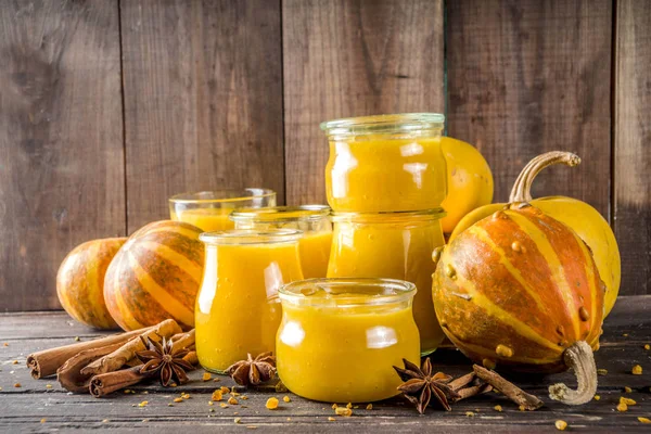 Pumpkin puree in different glass jars — Stock Photo, Image