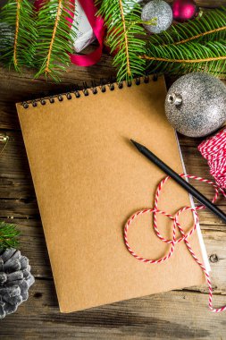 Christmas background with blank notebook clipart